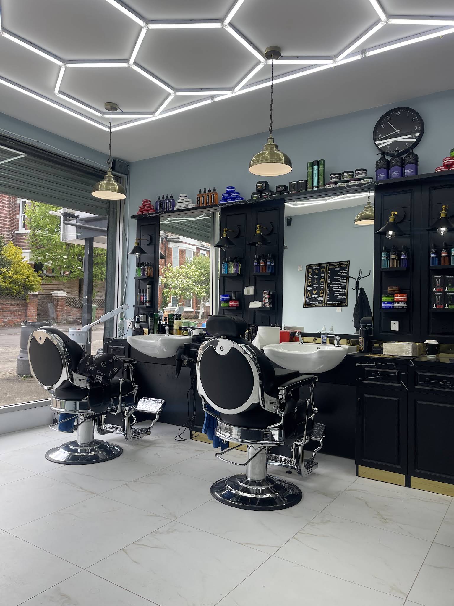 Royal Barbers Shirley barber stations with vintage chairs, sinks and mirrors